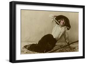 Young Woman in a Large Hat Sitting on Straw-null-Framed Photographic Print