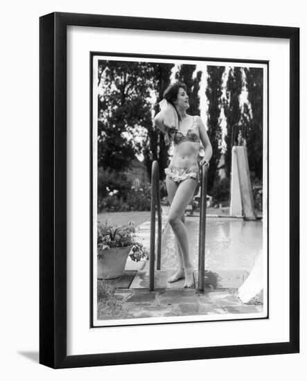 Young Woman in an Abstract Print Bikini with Broderie Anglaise Trim Towel Dries Her Hair-null-Framed Art Print