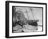 Young Woman in Headscarf and Working Clothes Looks out to Sea from the Shoreline-null-Framed Photographic Print