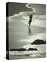 Young Woman in Silhouette Running Along Beach at Twilight Throwing Beach Ball Up in the Air-Co Rentmeester-Stretched Canvas