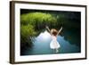 Young Woman in White Dress Jumping into a Idyllic Lake-Luna Vandoorne-Framed Photographic Print