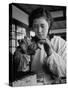 Young Woman Inserting Mother-Of-Pearl Bead into Live Oyster at Pearl Factory-Alfred Eisenstaedt-Stretched Canvas