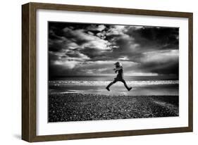 Young Woman Jumping on Beach-Rory Garforth-Framed Photographic Print