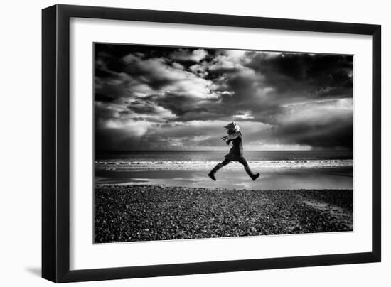 Young Woman Jumping on Beach-Rory Garforth-Framed Photographic Print