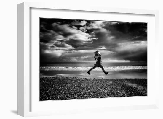 Young Woman Jumping on Beach-Rory Garforth-Framed Photographic Print