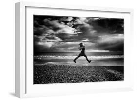 Young Woman Jumping on Beach-Rory Garforth-Framed Photographic Print