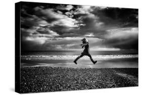 Young Woman Jumping on Beach-Rory Garforth-Stretched Canvas