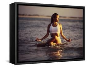 Young Woman Meditating at the Beach-null-Framed Stretched Canvas