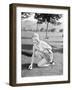 Young Woman on a Golf Course Placing a Golf Ball-null-Framed Photo