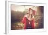 Young Woman Outdoors Wearing a Red Hat-Sabine Rosch-Framed Photographic Print