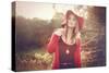 Young Woman Outdoors Wearing a Red Hat-Sabine Rosch-Stretched Canvas