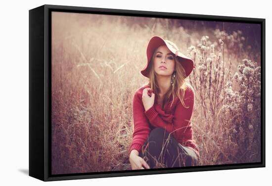 Young Woman Outdoors Wearing a Red Hat-Sabine Rosch-Framed Stretched Canvas