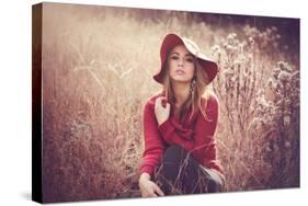 Young Woman Outdoors Wearing a Red Hat-Sabine Rosch-Stretched Canvas