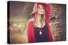 Young Woman Outdoors Wearing a Red Hat-Sabine Rosch-Stretched Canvas