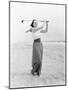 Young Woman Playing Golf at the Beach-null-Mounted Photo