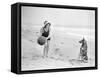 Young Woman Playing with Her Dog and Ball on the Beach-null-Framed Stretched Canvas