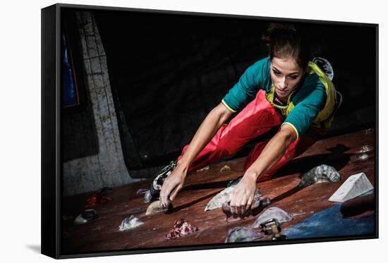 Young Woman Practicing Rock-Climbing on a Rock Wall Indoors-NejroN Photo-Framed Stretched Canvas