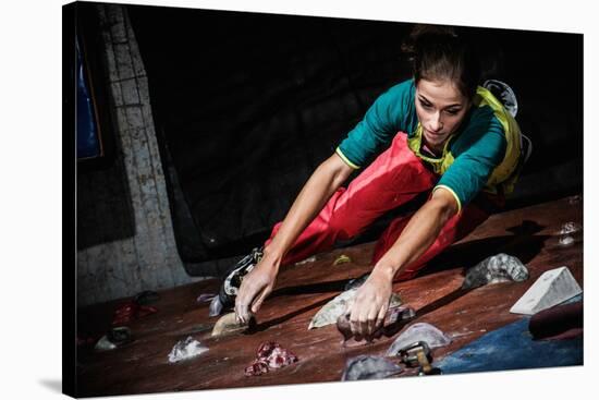 Young Woman Practicing Rock-Climbing on a Rock Wall Indoors-NejroN Photo-Stretched Canvas