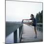 Young Woman Prepares for Jogging-Aaron McCoy-Mounted Photographic Print