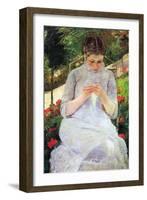 Young Woman Sewing In The Garden-Mary Cassatt-Framed Art Print