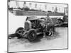 Young Woman Sitting Next to Small Car Looking at the Engine with Her German Shepherd-null-Mounted Photo