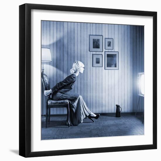 Young Woman Sitting on a Chair in Vintage Interior and Watching Retro TV-viczast-Framed Photographic Print