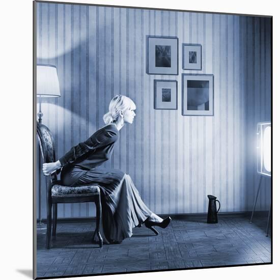 Young Woman Sitting on a Chair in Vintage Interior and Watching Retro TV-viczast-Mounted Photographic Print