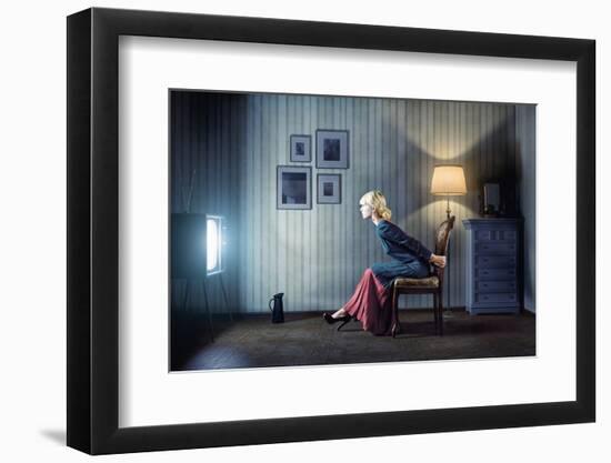 Young Woman Sitting on a Chair in Vintage Interior and Watching Retro TV-viczast-Framed Photographic Print