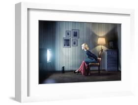 Young Woman Sitting on a Chair in Vintage Interior and Watching Retro TV-viczast-Framed Photographic Print