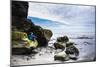 Young Woman Sitting On A Water Sculpted Rock Watches Waves Roll In At Ruby Beach In The Olympic NP-Ben Herndon-Mounted Photographic Print