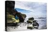 Young Woman Sitting On A Water Sculpted Rock Watches Waves Roll In At Ruby Beach In The Olympic NP-Ben Herndon-Stretched Canvas