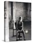 Young Woman Sitting on a Weight Bench-null-Stretched Canvas
