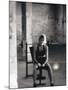 Young Woman Sitting on a Weight Bench-null-Mounted Photographic Print