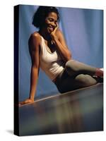 Young Woman Sitting on the Floor Smiling-null-Stretched Canvas