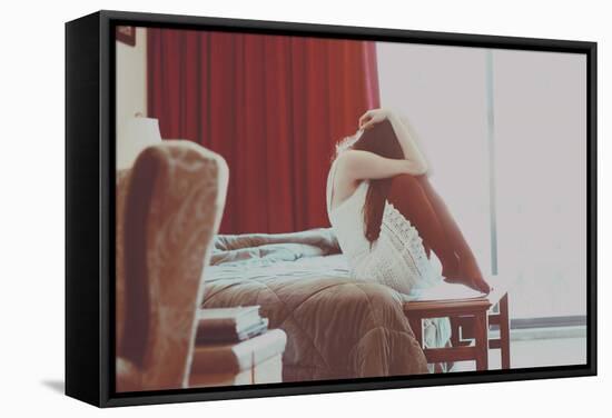 Young Woman Sitting with Head Covered-Carolina Hernandez-Framed Stretched Canvas