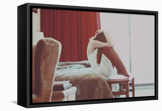 Young Woman Sitting with Head Covered-Carolina Hernandez-Framed Stretched Canvas