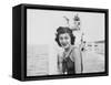 Young Woman Smiles and Sits on a Swimming Pier, Ca. 1938-null-Framed Stretched Canvas