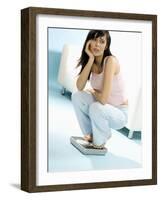 Young Woman, Squatting on Scales, Chin in Hand-null-Framed Photographic Print