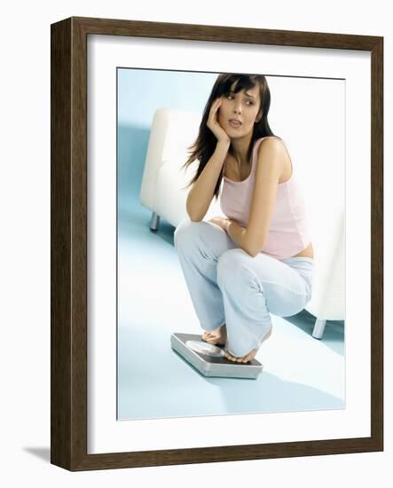 Young Woman, Squatting on Scales, Chin in Hand-null-Framed Photographic Print