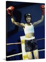 Young Woman Standing in a Boxing Ring-null-Stretched Canvas