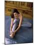 Young Woman Stretching on the Floor-null-Mounted Photographic Print