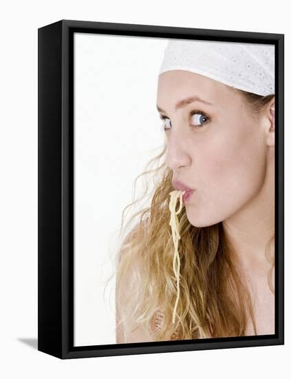 Young Woman Sucking Spaghetti-null-Framed Stretched Canvas