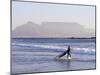 Young Woman Surfer Enters the Water of the Atlantic Ocean with Table Mountain in the Background-Yadid Levy-Mounted Photographic Print