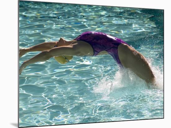 Young Woman Swimming the Backstroke in a Swimming Pool, Bainbridge Island, Washington, USA-null-Mounted Photographic Print