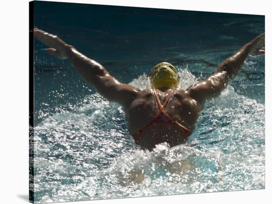 Young Woman Swimming the Butterfly Stroke in a Swimming Pool, Bainbridge Island, Washington, USA-null-Stretched Canvas