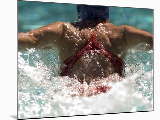 Young Woman Swimming the Butterfly Stroke in a Swimming Pool, Bainbridge Island, Washington, USA-null-Mounted Photographic Print