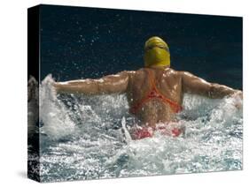 Young Woman Swimming the Butterfly Stroke in a Swimming Pool, Bainbridge Island, Washington, USA-null-Stretched Canvas