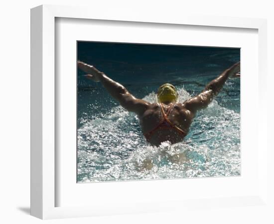 Young Woman Swimming the Butterfly Stroke in a Swimming Pool, Bainbridge Island, Washington, USA-null-Framed Photographic Print