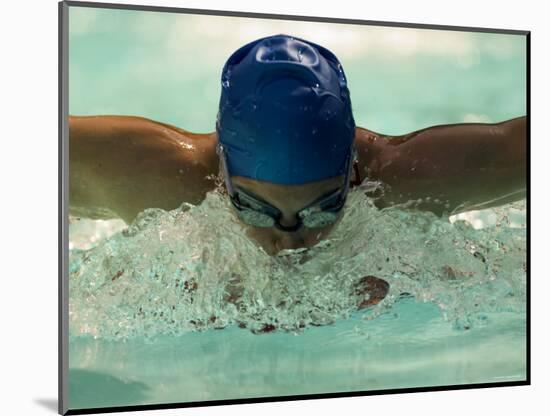 Young Woman Swimming the Butterfly Stroke in a Swimming Pool, Bainbridge Island, Washington, USA-null-Mounted Photographic Print