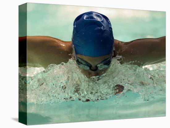 Young Woman Swimming the Butterfly Stroke in a Swimming Pool, Bainbridge Island, Washington, USA-null-Stretched Canvas